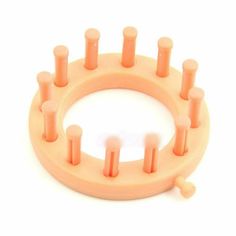 an orange plastic ring with five candles on it and the price is $ 5 00