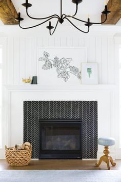 a living room with a fire place and white walls