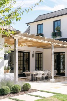 Transform your outdoor space with these patio pergola designs. From cozy and modern ideas to covered porches attached to your house, find the perfect pergola for your backyard or garden. Pergola Off Sunroom, Adding Pergola To Back Of House, White Pergola Attached To House, Outdoor Pergola Attached To House, Pergola Off House, Attached Pergola Ideas, Luxury Pergola, Patio Pergola Ideas, Pergola Porch