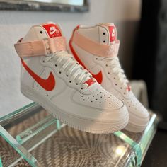 Make A Bold Fashion Statement In The Nike Air Force 1 High "Pearl Orange" - Size 7 - Rare! These Rare Sample Production Sneakers Are Sure To Turn Heads. These Women’s-Exclusive Pair Is Dressed In A “White/Orange/Orange Pearl” Colorway That Is Sure To Stand Out In The Crowd. The Iconic Profile Swooshes And Branded Heel Panels Have Been Updated In A Vibrant Citrus Tone, While The Signature Ankle Strap Gets A Subtle Clean Look Thanks To An “Orange Pearl” Tone. The Top Of The Tongue Also Includes The Faint Hue, While Other Details Such As The Labels And Lace Dubraes Return To The Eye-Catching Orange Shade. Underneath The Sneaker, The Bruce Kilgore-Designed Arrangement Remains In Its Tr White Custom Sneakers With Red Sole, Custom White Sneakers With Red Sole, Nike Air Force 1 High, Air Force 1 High, Orange Orange, Shades Of Orange, Nike Air Force 1, White Nikes, Air Force 1