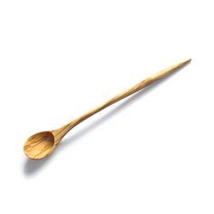 a wooden spoon sitting on top of a white surface