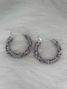 Hi Everyone, Hoop earrings just for you,  Handmade Earrings, Pink, Turquoise, Clear, Petite Beads, Silver Hoop Earrings. Handmade fashion jewelry accessories perfect gifts for her and for a special friend. Can be for everyday look for women and her fashion accessory. The length is about 2 inches from top to bottom. And the wide is about 2 inches to side to side. Thank you for looking at my jewelry shop. Handmade Small Hoop Turquoise Beaded Earrings, Turquoise Beaded Small Hoop Earrings, Handmade Turquoise Hoop Earrings, Turquoise Beaded Earrings With Small Hoop, Turquoise Hoop Beaded Earrings For Jewelry Making, Turquoise Wire Wrapped Small Hoop Earrings, Handmade Fashion Jewelry, Pink Turquoise, Fashion Accessories Jewelry