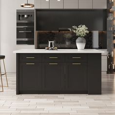 a kitchen with black cabinets and white counter tops, gold accents on the doors and drawers