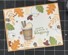 a close up of a card on a table with some scissors and other crafting supplies