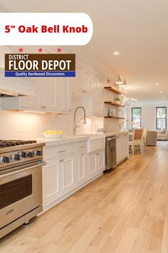 a kitchen with white cabinets and wood floors is featured for 5 oak belk knob