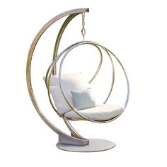 a white swing chair hanging from a chain with pillows on it's back end