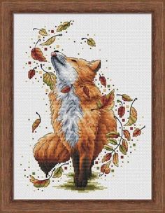 a cross stitch picture of a fox with autumn leaves