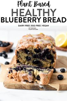 a loaf of blueberry bread sitting on top of a cutting board