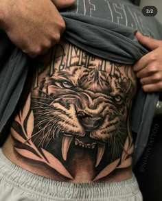 a man with a tiger tattoo on his stomach