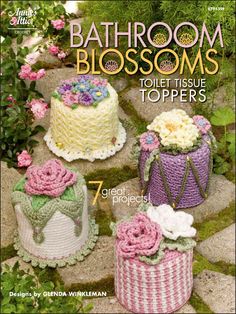 the cover of bathroom blossom's toilet tissue toppers, featuring four cakes and flowers