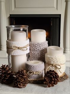 candles are wrapped in twine and placed next to pine cones