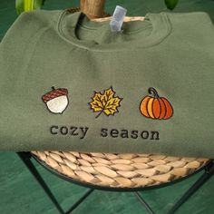 Autumn Day sweatshirt, Autumn Sweatshirt, fall embroidered crewneck for halloween, Halloween sweatshirt for autumn, Unisex halloween crewneck, Autumn sweatshirt for halloween I've included images showing the design on a Military Green Sweatshirt, please message me for specific sweatshirt colour requests/a request for changing the embroidery colour. Check out our Shop filled with so many Designs! https://www.etsy.com/uk/shop/TahikoStitch ⬅️⬅️⬅️ Don't FORGET to ❤️ like this listing 🤗 ▶️ HOW TO OR Long Sleeve T-shirt With Embroidered Graphics For Fall, Custom Embroidery Long Sleeve T-shirt For Fall, Halloween Long Sleeve Sweatshirt With Custom Embroidery, Long Sleeve Halloween Sweatshirt With Custom Embroidery, Long Sleeve Sweatshirt With Custom Embroidery For Halloween, Long Sleeve Custom Embroidered Sweatshirt For Halloween, Embroidered Crew Neck Sweater For Fall, Fall Sweatshirt With Embroidered Graphics, Casual Halloween Sweatshirt With Custom Embroidery