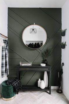 a black and white entryway with green accents