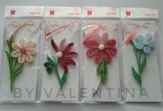 four different types of paper flowers are in the package