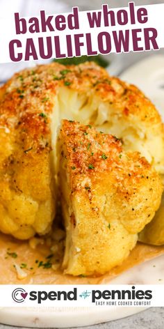 baked whole cauliflower on a plate with text overlay