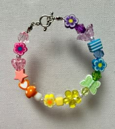 a colorful bracelet with flowers and butterflies on it