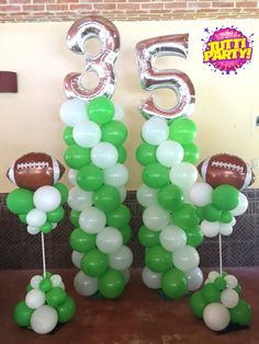 balloons are arranged in the shape of numbers and footballs