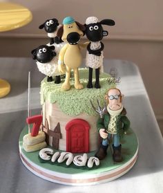 a birthday cake with sheep on top of it