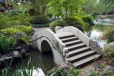 the steps lead up to an artificial pond