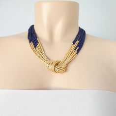 "Navy blue and gold necklace. Size shown is 18\". The gold beads are actually a light, refined shade of gold, so if you are worried about matching it, we have the earrings that do the trick: https://www.etsy.com/listing/218792281/light-gold-beaded-earrings-gold More items in navy: https://www.etsy.com/shop/StephanieMartinCo?ref=simple-shop-header-name&listing_id=262159552&ga_search_query=garnet&search_query=navy&page=1#items ❤ SIZES This item comes in several sizes, kindly choose Elegant Royal Blue Necklace For Party, Elegant Royal Blue Party Necklace, Elegant Blue Beaded Necklaces For Party, Elegant Royal Blue Beaded Necklaces With Round Beads, Elegant Royal Blue Round Bead Necklaces, Elegant Royal Blue Beaded Necklace With Round Beads, Elegant Royal Blue Round Beads Necklace, Elegant Royal Blue Round Beaded Necklace, Handmade Elegant Blue Bridal Necklace