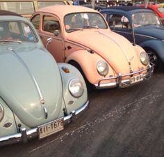 several different colored cars parked next to each other