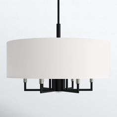 a black and white chandelier with three lights hanging from it's sides