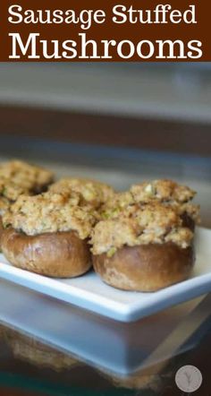 sausage stuffed mushrooms on a white plate with text overlay that reads sausage stuffed mushrooms