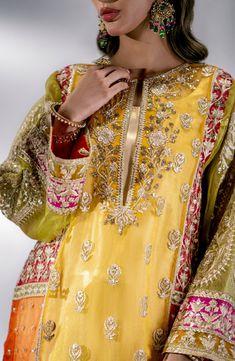 Yellow Pakistani Wedding Dress in Embroidered Kameez Sharara Style is all set to win your hearts as we are working on new themes that hold traditional value has always been our forte and each time we give our heart and soul to envision and create a collection that speaks to our customers on a personal level. Embroidered Kameez: Yellow Dresses for Mehndi is an evergreen color for weddings. It Both hypothesizes and abstracts a picture of a culture that represents our values and beliefs through the Sharara Style, Yellow Sharara, Pakistani Boutique, Net Design, Pakistani Wedding Outfits, Pakistani Wedding Dress, Readymade Saree, Lehenga Skirt, Organza Dress