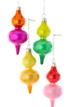 three different colored ornaments hanging from strings