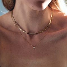 Shine everyday with this stylish layered duo. Consisting of two necklaces, mix and match with our patented design. Chain Italian chain, width 5mm Adjustable chain: 14-17in (35-43cm) Baguette Necklace Pendant: Height 3mm x Width 7mm Adjustable chain: 15-17in (38-43cm) Gold Vermeil Cubic Zirconia Hypoallergenic, lead and nickel free #034G-283G Modern Double Strand Everyday Necklaces, Modern Double Strand Necklace For Everyday, Modern Double Chain Necklace For Everyday, Elegant Rectangular Necklace For Everyday Use, Chic Everyday Double Strand Layered Necklace, Elegant Everyday Chain Necklace, Everyday Double Chain Necklaces With Rectangular Links, Elegant Chain Link Layered Necklace For Everyday, Elegant Everyday Layered Chain Link Necklace