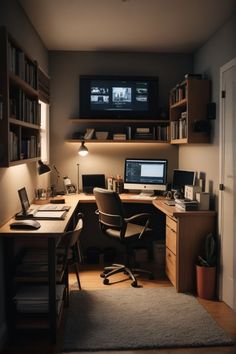 a home office with two computer screens on the wall