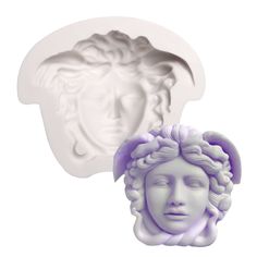 a cookie mold that looks like the head of a woman with curly hair and an angel's halo