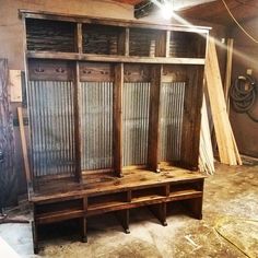 an old wooden cabinet with glass doors in a room that is being renovated and remolded