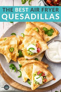 the best air fryer quesadillas recipe on a plate with sour cream