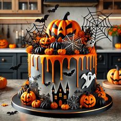 a halloween cake with orange icing and pumpkins on the top is sitting on a table