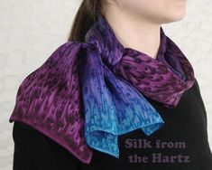 "Luxurious gift idea. Brighten your wardrobe with this versatile 11\" X 60\" silk satin scarf. Gift for the woman who loves purple. Luxuriously soft, individually hand dyed by a Seattle area artist. A sophisticated piece of wearable art, that can be worn for business or casual wear.  Design may vary slightly from the ones pictured. Lots of colors to choose from, see pictures.  Care directions: Steam set color fast, hand wash cold water.Hang to dry. The scarf gets softer the more you wear it. Take good care of it and you will enjoy it for years to come. See our \"How to Tie a Silk Scarf \" video on youtube.com/user/silkfromthehartz." Hand Dyed Silk Scarf, Purple Hands, Purple Scarves, Silk Scarf Painting, Raspberry Red, Dyed Silk, Loop Scarf, Hand Dyed Silk, Blue Hand