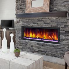 a living room with a large stone fireplace