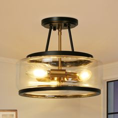 a light fixture hanging from the ceiling in a room