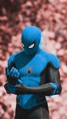 a close up of a person in a spider man costume holding a glove and looking at the camera