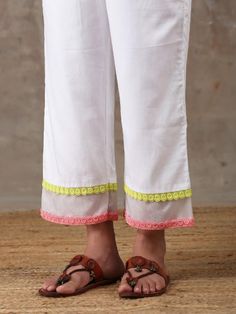 A three piece soft cotton kurta set in white comes with an attached mulmul lining. It has colour block laces with organza insert on the neck,sleeves and pants. It is paired with a white soft cotton straight pant with an attached mulmul lining with organza insert and colour block laces. Color: White Fabric Composition: Kurta Set - Soft cotton Dupatta - Organza Note: The product will be delivered within 20-25 days of order placed Care Instruction: Dry Clean Only. Do not use heavy Iron White Mulmul Palazzo Set, White Cotton Silk Sets With Embroidered Border, White Cotton Silk Palazzo Set For Eid, White Mulmul Palazzo Set For Designer Wear, White Embroidered Palazzo Set For Eid, White Cambric Sets For Diwali, Designer Cotton Palazzo Set With Gota Work, Cotton Palazzo Set With Embroidered Border For Summer, White Kurta With Gota Work For Spring