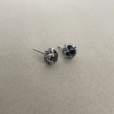 These Gothic studs are crafted with black cubic zirconia stones and made of stainless steel. With a timeless gothic design, these studs are perfect for everyday wear to give your look a subtle edge. Sold as pair Material : 316 Stainless steel Set with Black Cubic Zirconia Size: 9mm Post: 22G / standard piercing Closure: Butterfly push back Ships in a gift box Listing for gothic studs only Black Sterling Silver Edgy Earrings, Black Edgy Sterling Silver Earrings, Edgy Black Sterling Silver Earrings, Nickel Free Black Piercings Gift, Nickel-free Black Piercings As A Gift, Nickel-free Black Piercings As Gift, Black Sterling Silver Piercings For Gift, Black Nickel Free Piercings As A Gift, Nickel-free Black Piercings Gift