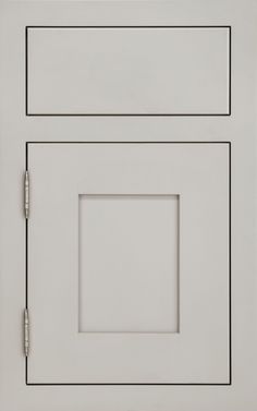 a white cabinet door with two square knobs on the front and one in the back