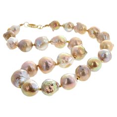 Brightly glowing brilliant goldy ocean cultured pearls ( averaging 18mm round approximately ) set in a 17 inch long necklace with gold plated clasp. Click through the pictures of this to see how magnificent the different natural colors are. Handmade Jewelry Display, Baroque Pearls Necklace, Ruby And Diamond Necklace, Keshi Pearl Necklace, Glowing Necklace, Pearl And Diamond Necklace, Handmade Jewelry Bracelets, Bold Necklace, Copper Pearl