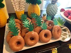 there are many donuts with pineapples on the top and one in the middle