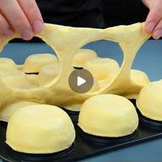 a video demonstrating how to make dough for buns on a baking sheet with an egg being cut in half