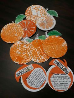 oranges cut out and placed on top of each other with words written in them