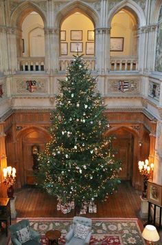 a large christmas tree in the middle of a room