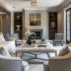 a living room with couches, chairs and a coffee table in front of a fireplace