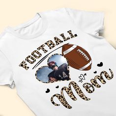 Elevate your game day spirit and style with our Personalized Shirt, the ultimate gift choice for football moms on birthdays, Mother's Day, Christmas, or any special occasion. Crafted with care, this shirt celebrates the unwavering support and dedication of football mothers. Customize it with a name or message to add a personal touch that reflects the unique bond between a football mom and her team. Whether worn on game days or throughout the year, this shirt is a fashionable and meaningful way f Customizable T-shirt For Football Season, Customizable Casual T-shirt For Football Season, Football Season Fan Apparel Tops With Custom Print, Sports Fan Sublimation Design For Football Season, Fan Apparel Tops With Custom Print For Football Season, Custom Print T-shirt For Game Day, Customizable Sports Fan Tops For Football Season, Customizable T-shirt For Game Day, Casual Customizable Football Season T-shirt