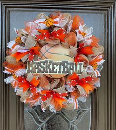 an orange and white wreath with the word basketball on it